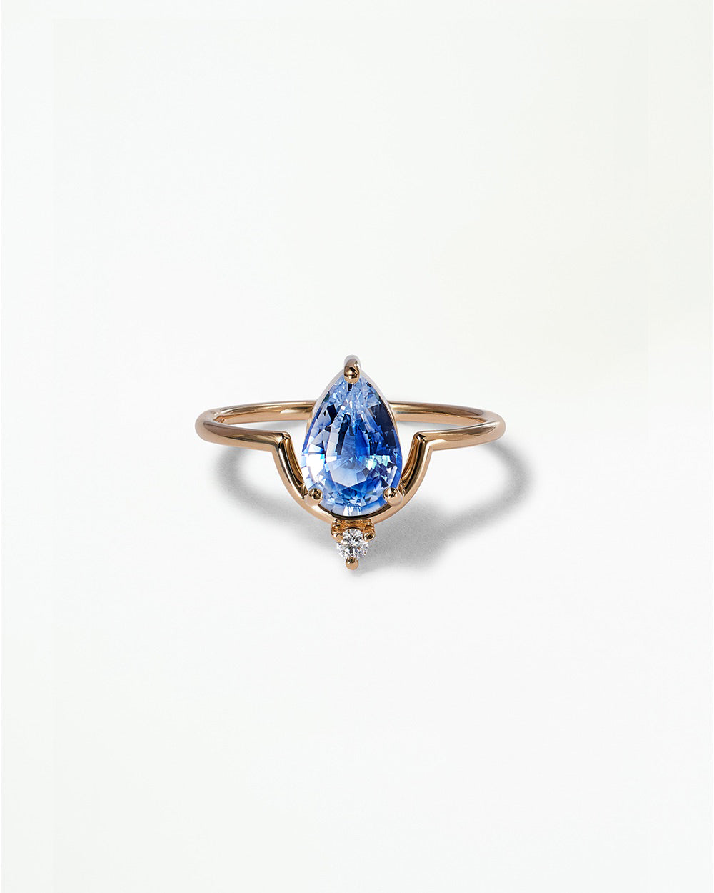 Pear Cut Sapphire Nestled Ring