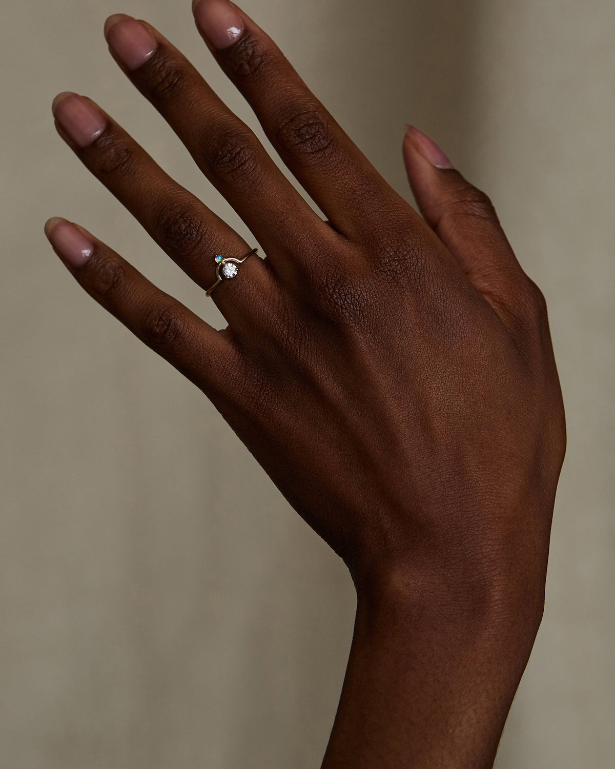 Small Round Cut Diamond and Opal Nestled Ring